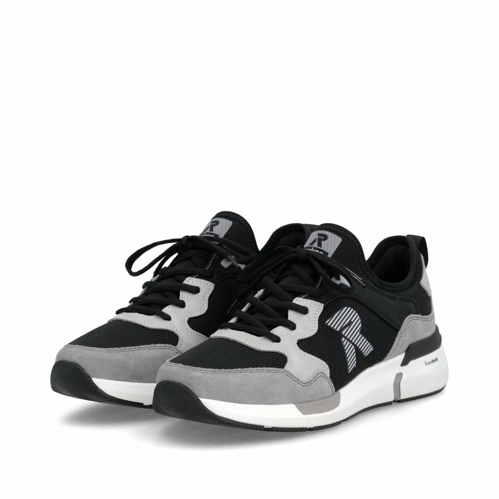 Mocassins Rieker noirs pour homme U1405-00 avec bande élastique. Chaussures inclinées sur le côté.