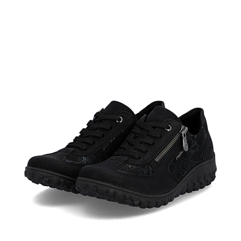 Baskets basses Rieker noires pour femmes 59501-00 avec fermeture éclair. Chaussures inclinées sur le côté.