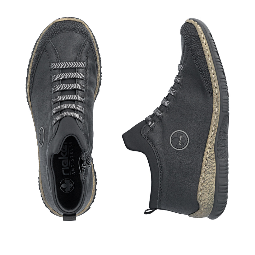 Schwarze Rieker Damen Kurzstiefel N3258-00 mit einem Reißverschluss. Schuh von oben, liegend.