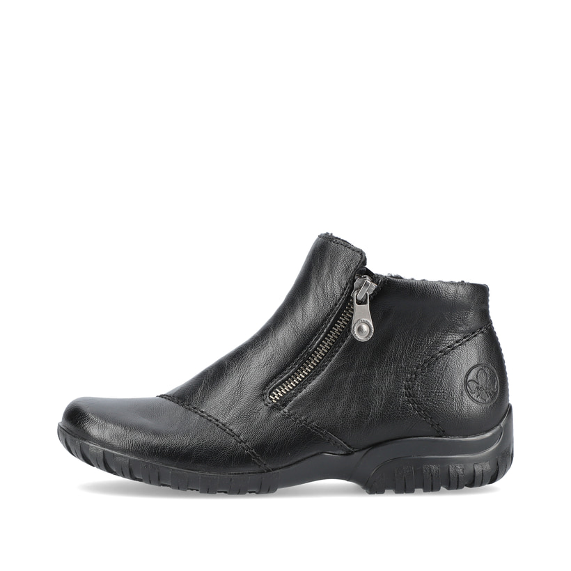 
Nachtschwarze Rieker Damen Slipper L4663-01 mit Reißverschluss sowie einer Profilsohle. Schuh Außenseite