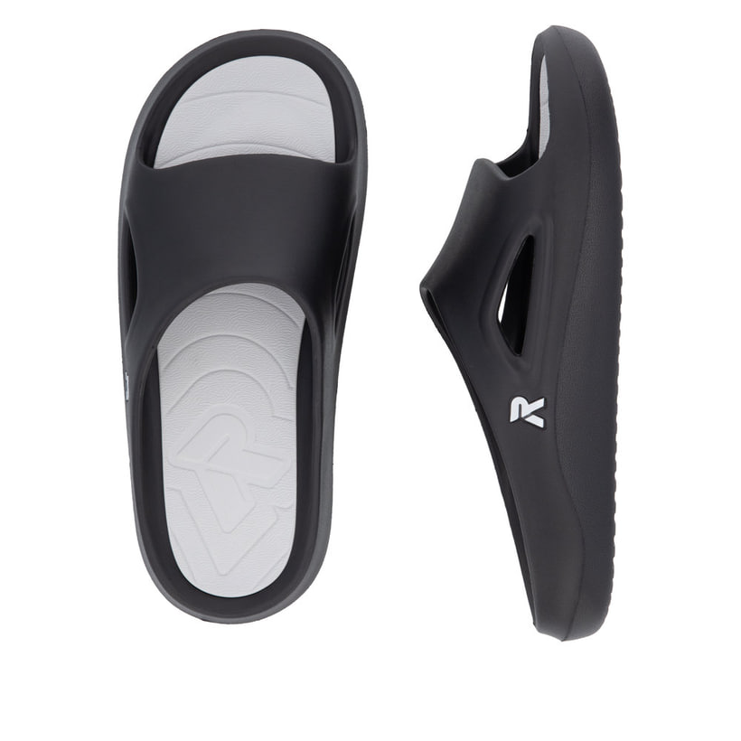 Schwarze Rieker Herren Pantoletten U3450-00 mit einer ultraleichten Sohle. Schuh von oben, liegend.