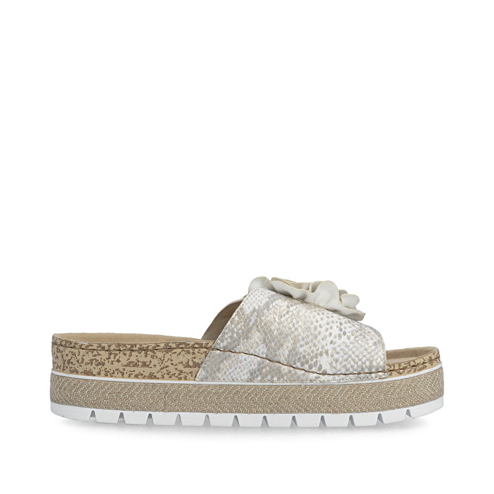 Mules Rieker dorées pour femme 69562-90 avec fleur décorative. Côté intérieur de la chaussure.