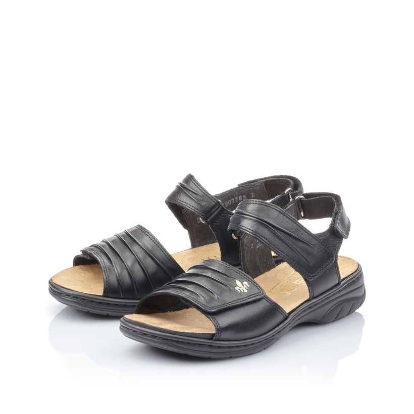 Schwarze Rieker Damen Riemchensandalen 64560-01 mit einem Klettverschluss. Schuhpaar seitlich schräg.