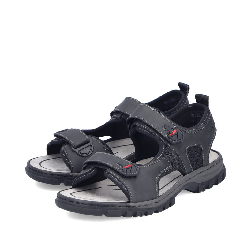 Schwarze Rieker Herren Trekkingsandalen 25055-00 mit einem Klettverschluss. Schuhpaar seitlich schräg.