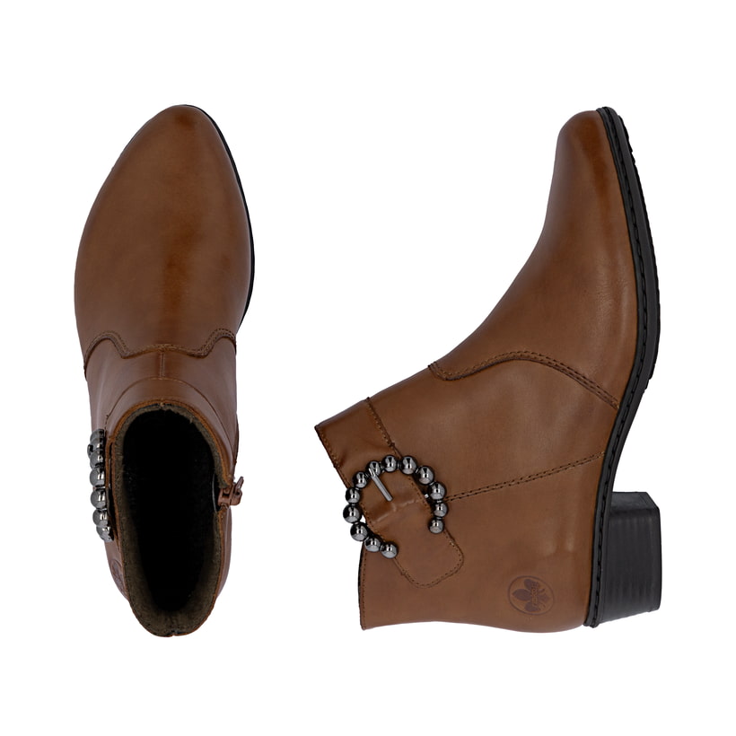 Braune Rieker Damen Stiefeletten Y0797-24 aus Glattleder mit trendiger Schnalle. Schuh von oben, liegend.