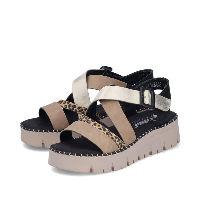 Sandales compensées Rieker multicolores pour femme V1063-90. Chaussures inclinées sur le côté.