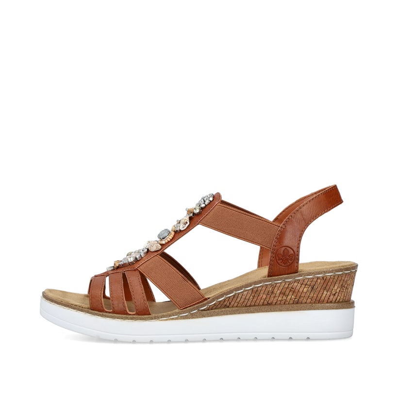 Braune Rieker Keilsandaletten V3869-24 mit Elastikeinsatz sowie Schmuckelementen. Schuh Außenseite.