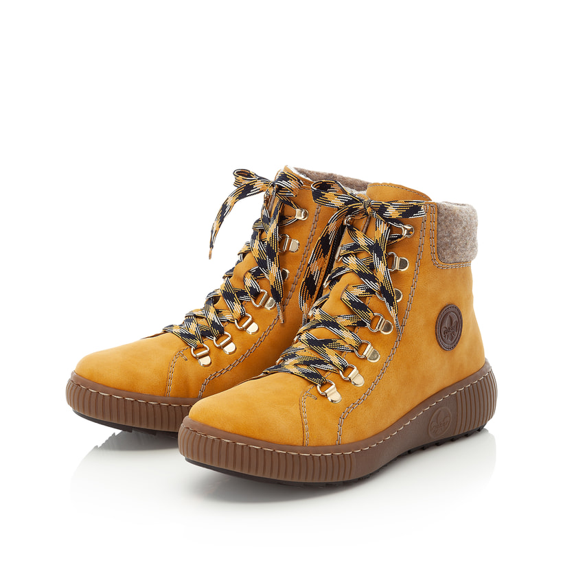 Gelbe Rieker Damen Schnürstiefel Z6633-68 mit Schaftkragen sowie Reißverschluss. Schuhpaar seitlich schräg.