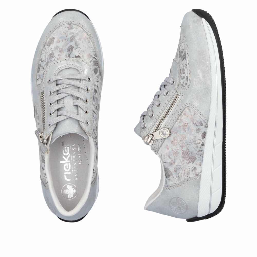 Baskets basses Rieker blanches pour femme N1112-80 avec motif floral. Chaussure vue de dessus, couchée.