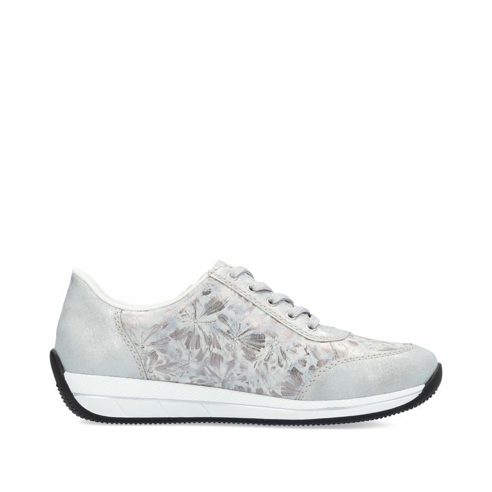 Baskets basses Rieker blanches pour femme N1112-80 avec motif floral. Côté intérieur de la chaussure.
