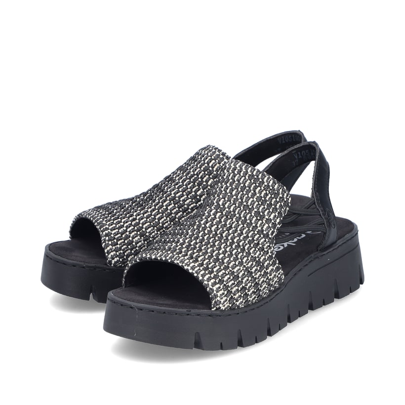 Sandales compensées Rieker noires femme V1051-00 avec bande élastique. Chaussures inclinées sur le côté.