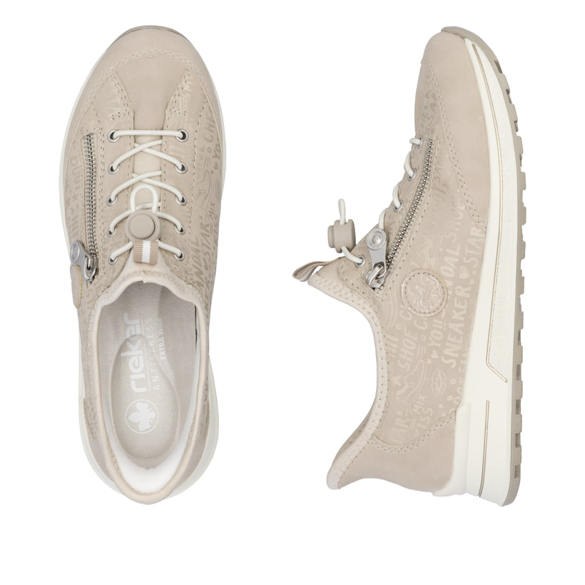 Beige Rieker Damen Slipper N1455-62 mit easy Hineinschlüpf-Möglichkeit. Schuh von oben, liegend.