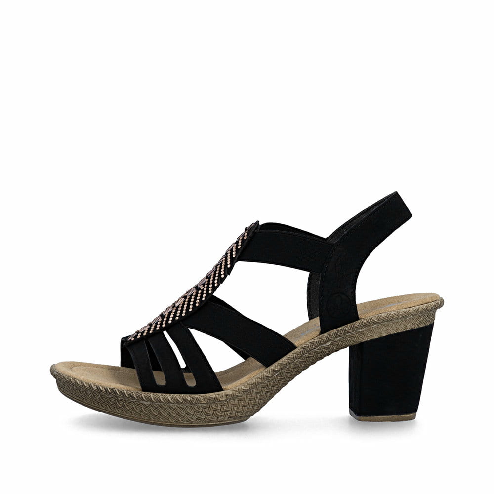 Schwarze Rieker Riemchensandaletten 66526-00 mit Strasssteinen sowie Gummizug. Schuh Außenseite.