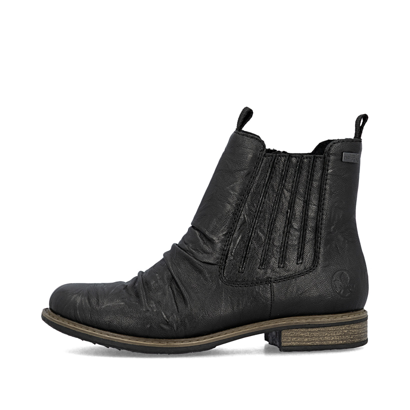 Chelsea Boots Rieker noires pour femme 74855-00 en cuir lisse. Côté extérieur de la chaussure.