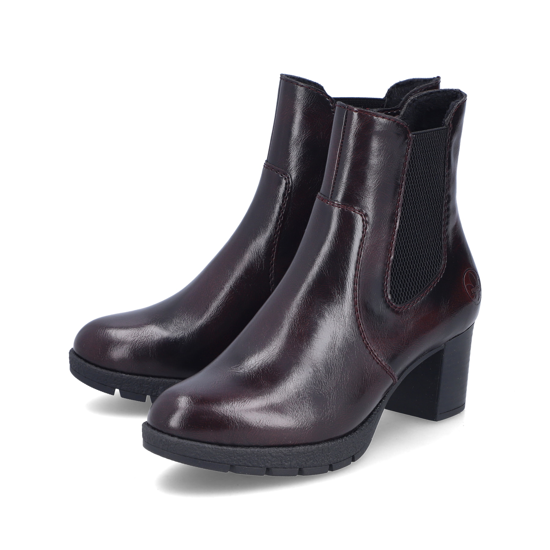 Rote Rieker Damen Stiefeletten 77674-35 mit Reißverschluss sowie Komfortweite G. Schuhpaar seitlich schräg.