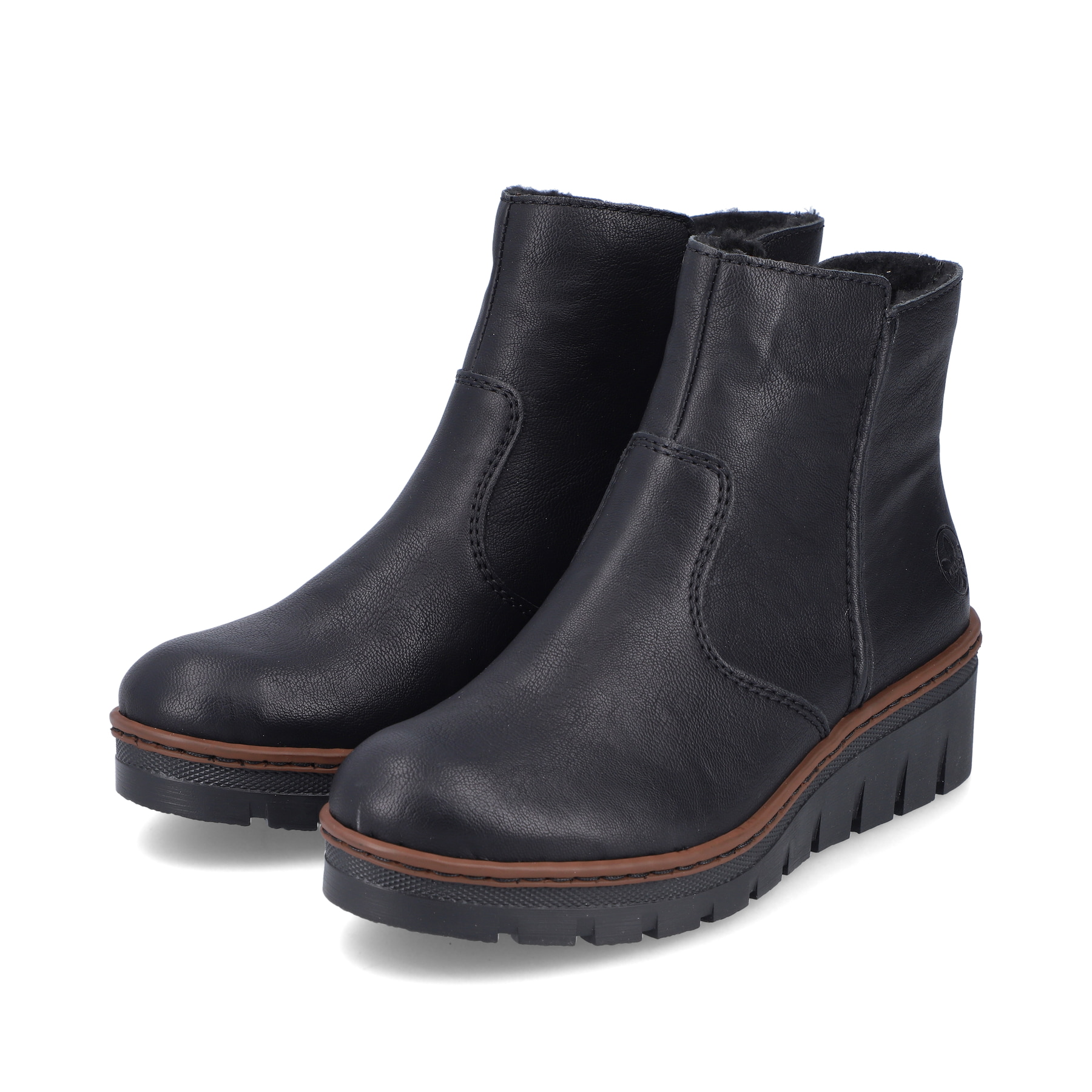 Bottines Rieker noires pour femmes X9165-00 avec fermeture éclair. Chaussures inclinées sur le côté.
