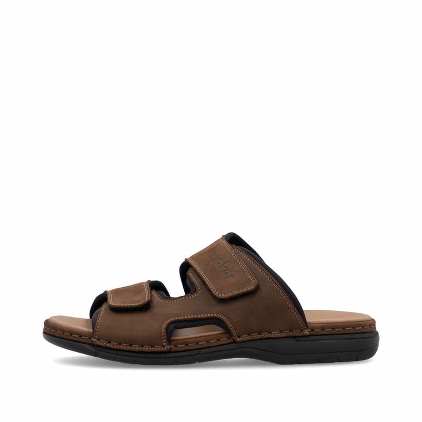 Mules Rieker marron homme 25559-25 en cuir velours avec fermeture velcro. Côté extérieur de la chaussure.