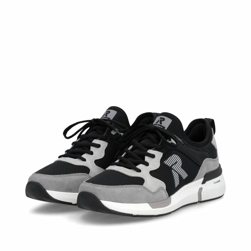 Mocassins Rieker noirs pour homme U1405-00 avec bande élastique. Chaussures inclinées sur le côté.