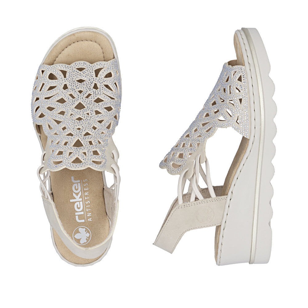 Beige Rieker Keilsandaletten 67465-62 mit Strasssteinen sowie einem Gummizug. Schuh von oben, liegend.