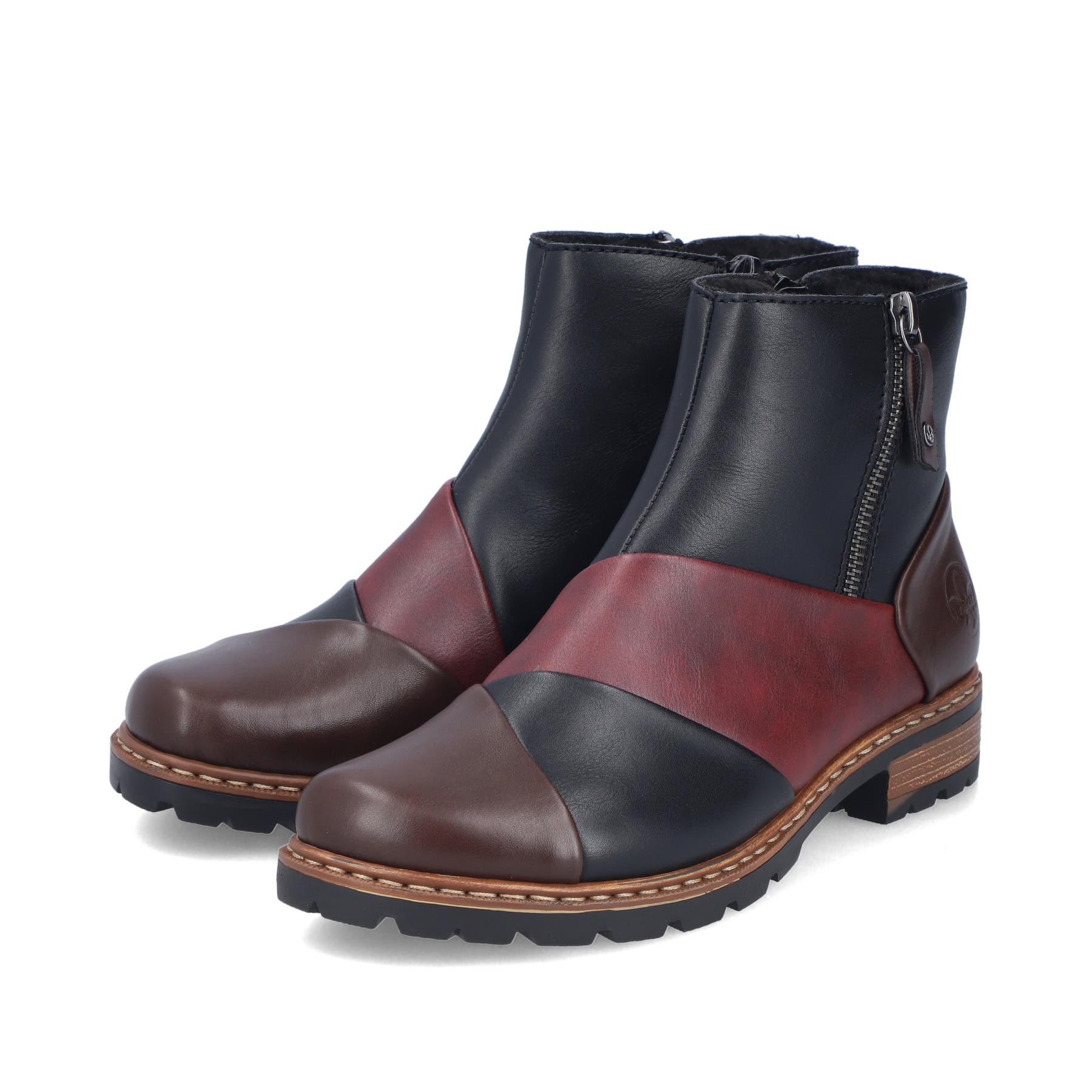 Dunkelblau-weinrote Rieker Damen Kurzstiefel Z9356-90 mit einem Reißverschluss. Schuhpaar seitlich schräg.
