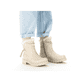 
Hellbeige Rieker Damen Kurzstiefel Y2470-60 mit Reißverschluss sowie einer Profilsohle. Schuh am Fuß