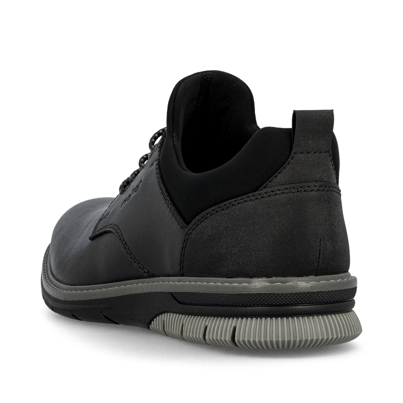 Tiefschwarze Rieker Herren Slipper 14454-01 mit Elastikeinsatz sowie einer Profilsohle. Schuh von hinten