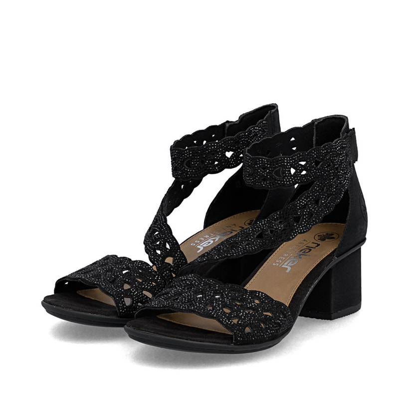 Schwarze Rieker Riemchensandaletten 64657-00 mit Strasssteinen. Schuhpaar seitlich schräg.