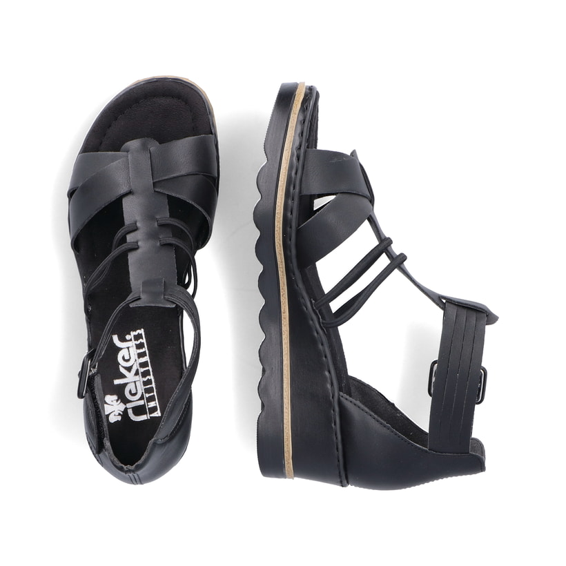 Schwarze Rieker Keilsandaletten 67480-01 mit trendigen Schnalle. Schuh von oben, liegend.