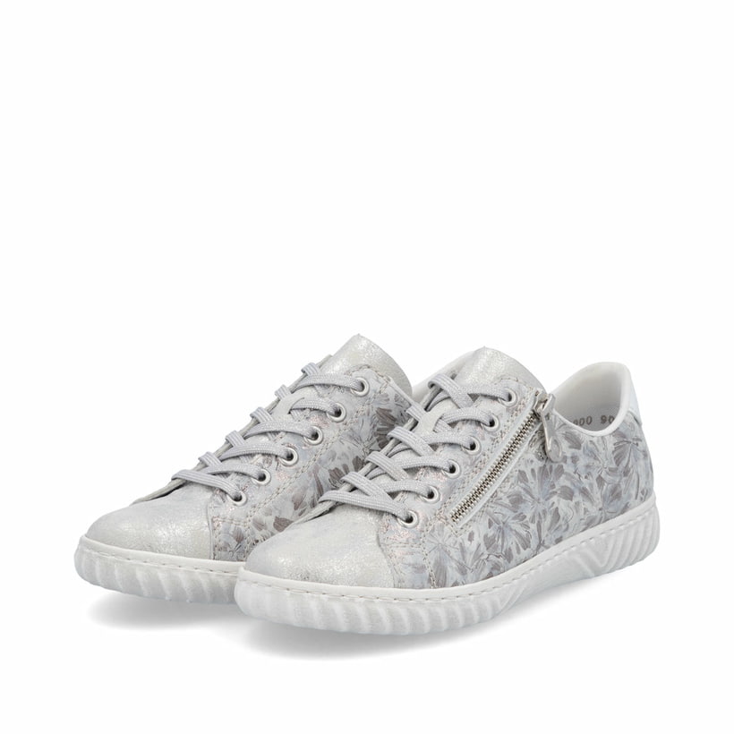 Baskets basses Rieker argent pour femme N0900-90 avec motif floral. Chaussures inclinées sur le côté.