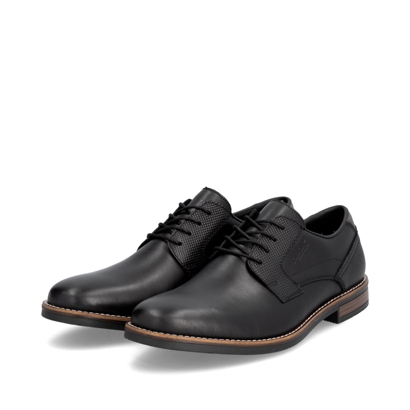 Schwarze Rieker Herren Schnürschuhe 13523-00 aus Glattleder. Schuhpaar seitlich schräg.