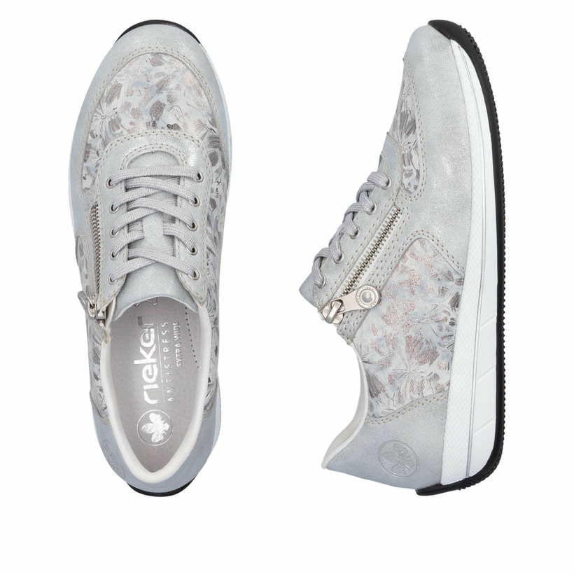 Baskets basses Rieker blanches pour femme N1112-80 avec motif floral. Chaussure vue de dessus, couchée.