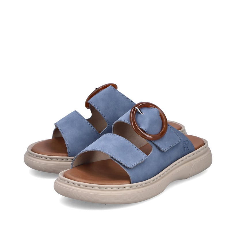 Mules Rieker bleues pour femme V3050-14 avec boucle tendance. Chaussures inclinées sur le côté.