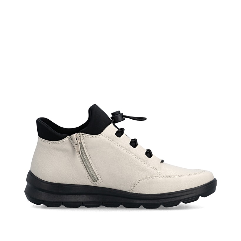 Bottines Rieker beiges pour femmes Z0065-60 avec fermeture éclair. Côté intérieur de la chaussure.