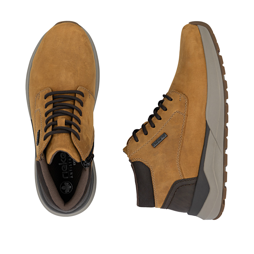 Bottes à lacets Rieker jaunes pour homme 06001-68 en cuir suédé. Chaussure vue de dessus, couchée.