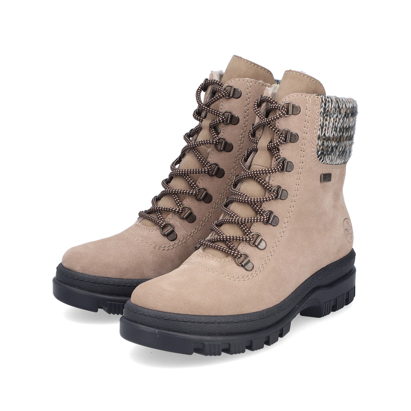 Beige-schwarze Rieker Damen Schnürstiefel X8233-64 aus Rauleder. Schuhpaar seitlich schräg.