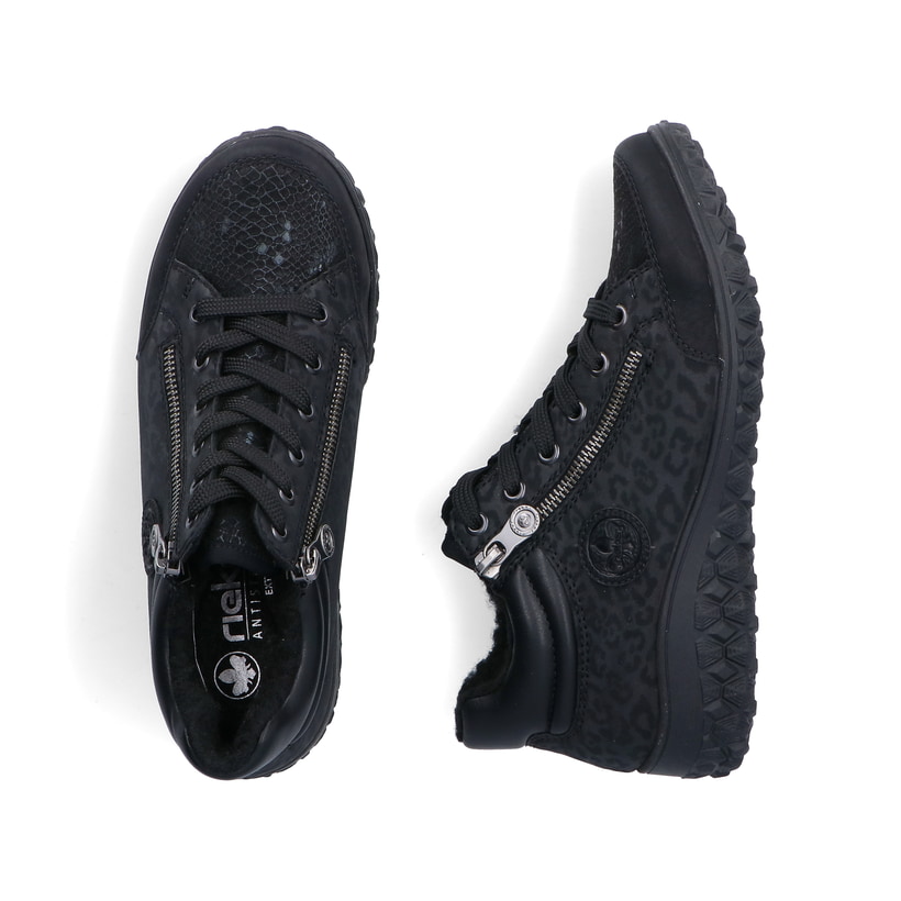 Schwarze Rieker Damen Kurzstiefel 59500-00 mit Leo-Print sowie Reißverschluss. Schuh von oben, liegend.