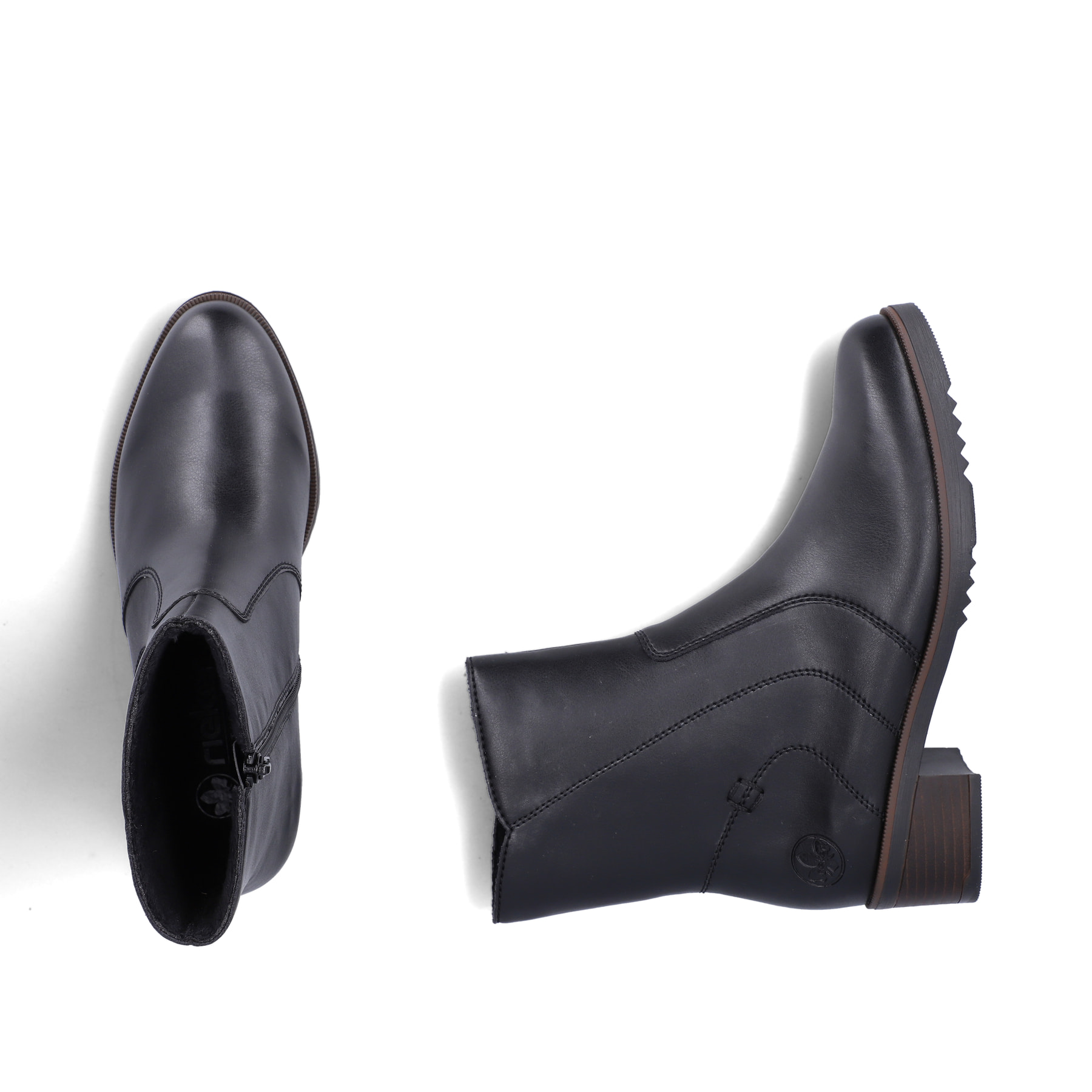 Schwarze Rieker Damen Kurzstiefel Y0581-00 mit modernen Ziernähten. Schuh von oben, liegend.
